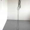 Fifty seven stories of one  line, 2011, metal rod & rubber line